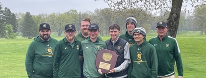 Photo of the 2025 men's golf team standing outside holding their Regional Championship plaque.