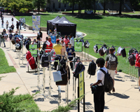 Photo of the "Send Silence Packing" Exhibit set up on a college campus. 