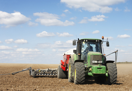 Tractor plowing field
