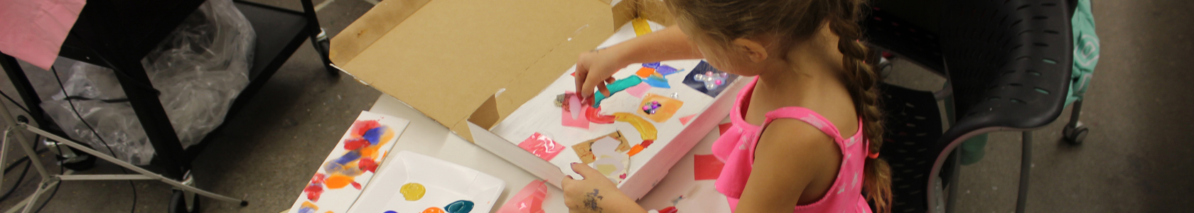 Summer camper making crafts