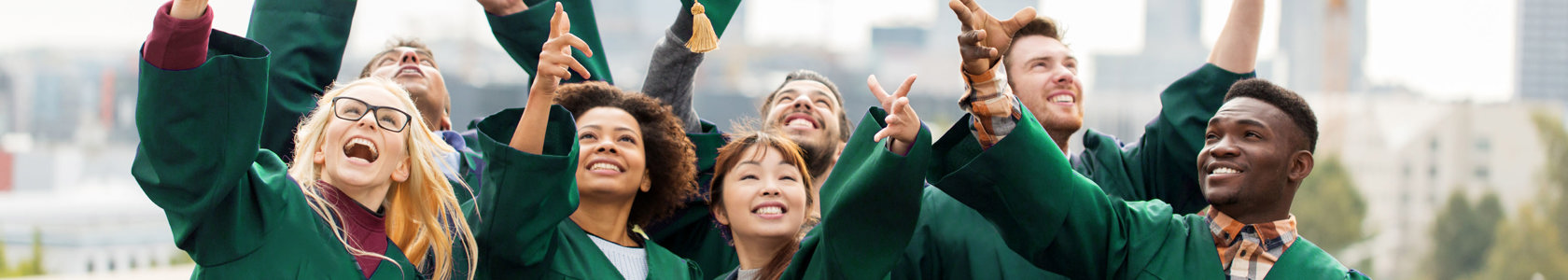 Graduates throwing caps in the air