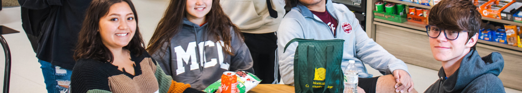 students sitting together at a table in MCC's woodside café