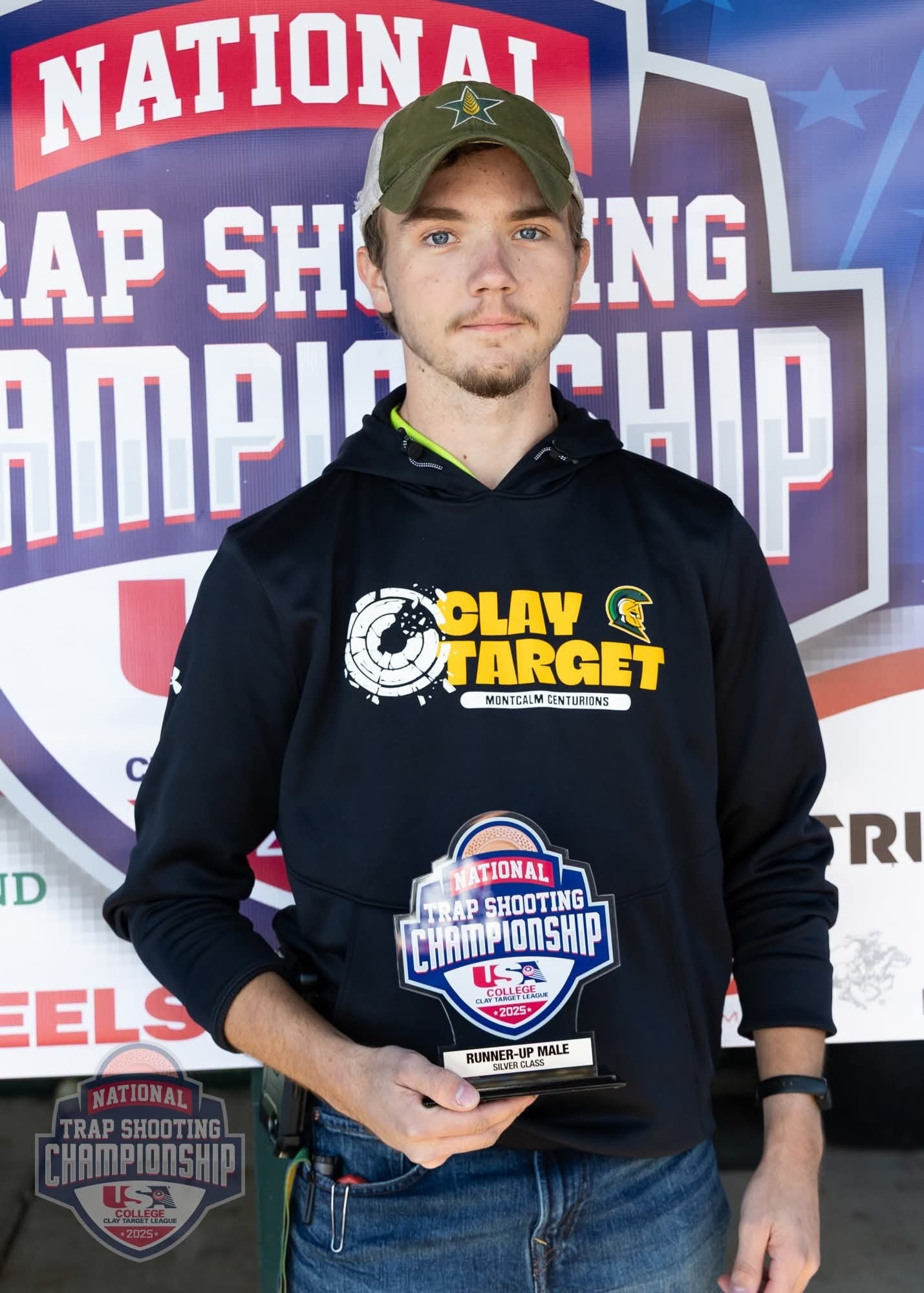 Photo of MCC Clay Target team member Evan Plonka holding up his award at the National Trap Shooting Championship.