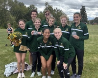 Team photo of men's and women's cross country team at the GRCC Invitational.