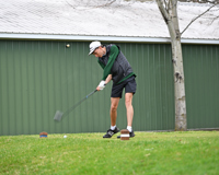 MCC golfer driving the ball.