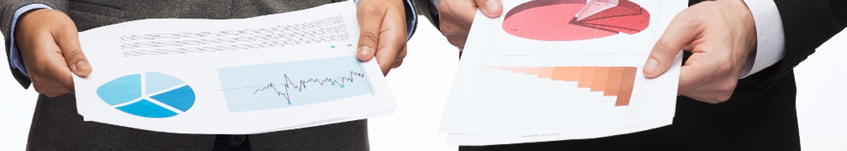 Photo of people holding business diagrams