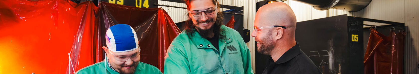 Three Welders working together.